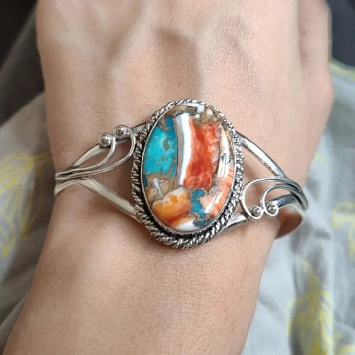 Bracelet with a Design Inlaid with Radiant Gemstones